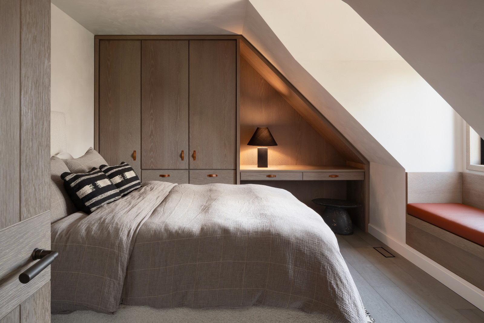 The guest bedroom of a renovated ski chalet in Quebec, Canada, designed by ACDO