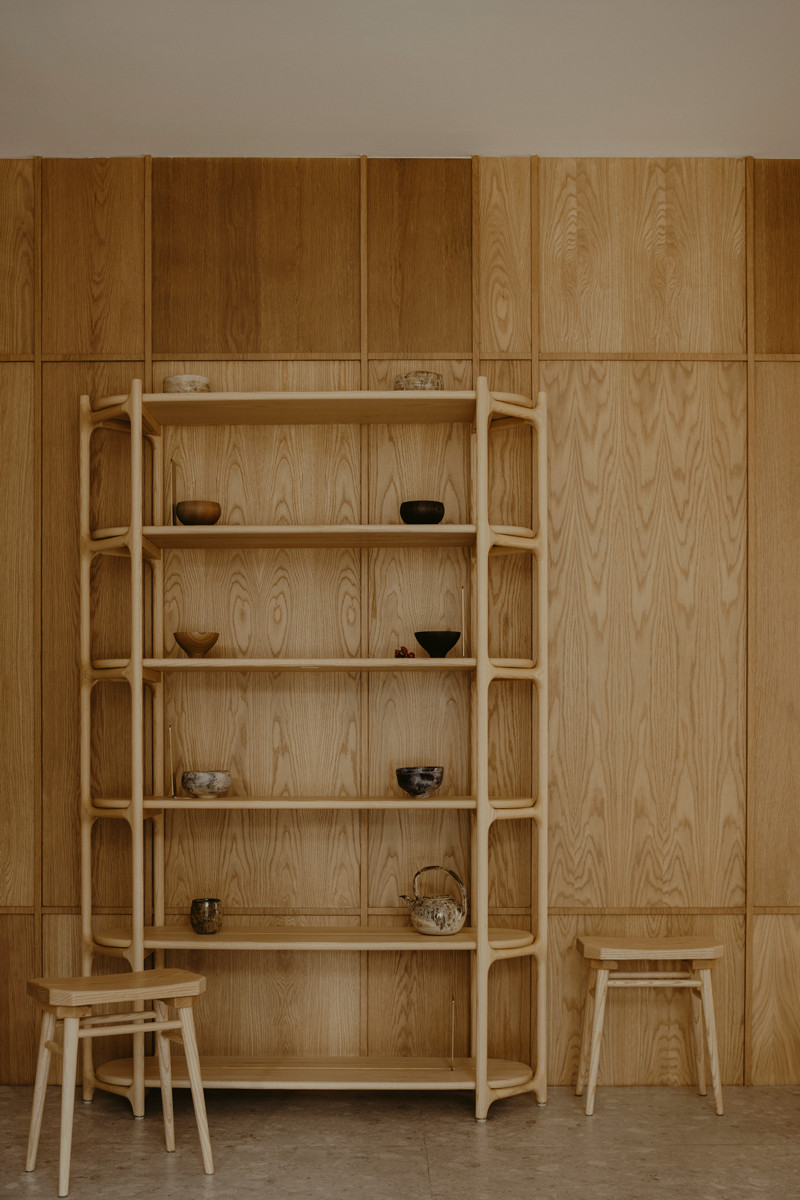 The intricacies of this vignette are unified by its components’ harmonious timber finishes
