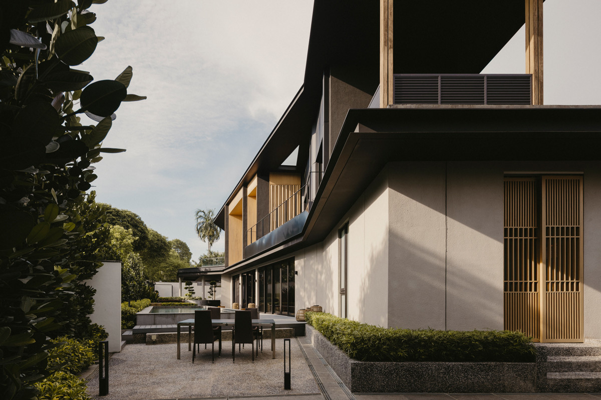 Timber detailing serves as a cultural homage and adds eye-catching accents to the Good Class Bungalow’s facade