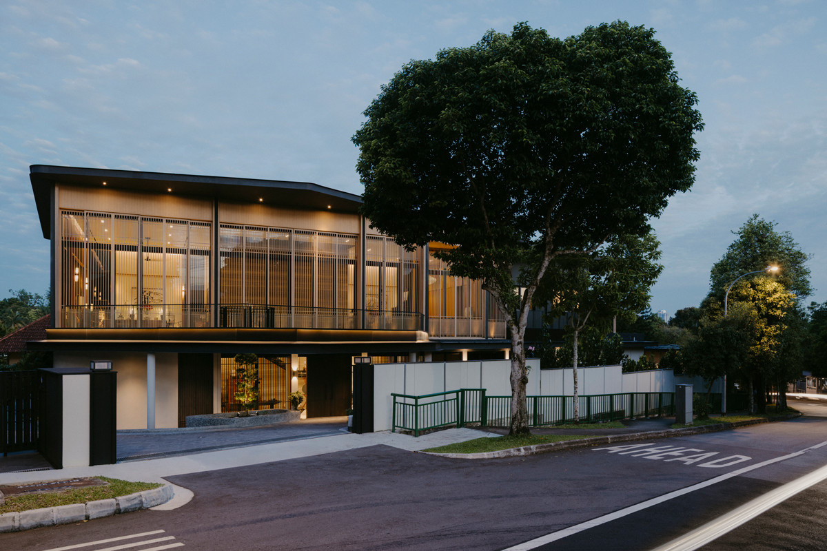 As evening falls, the interiors of the Good Class Bungalow take on a gentle glow, echoing the home’s muse: the quiet elegance of a birdcage