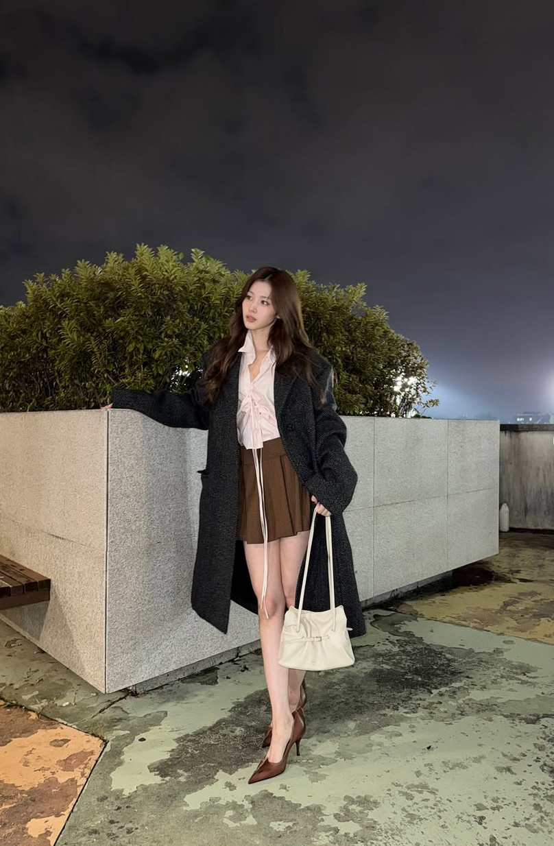 Sana balances romantic layering with her dark academia-inspired ensemble (Photo: m.by__sana / Instagram)