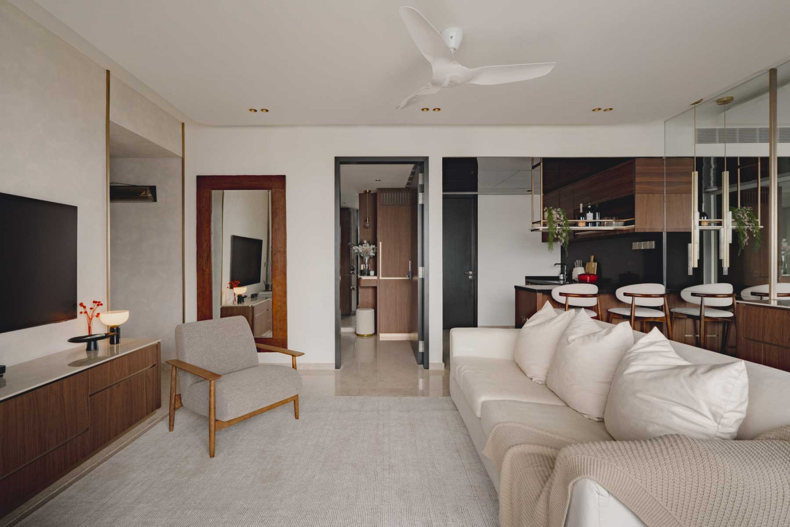 The breezy living space augments its neutral base with warmth and tactility