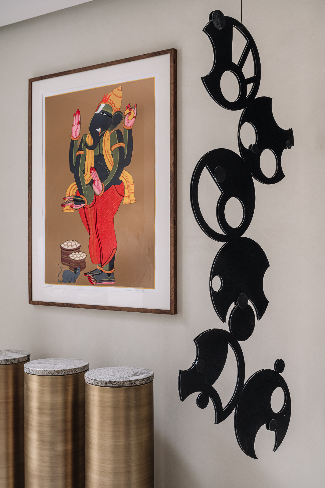 Playful artworks on display in a Japandi-inspired living room in an Ahmedabad, India, home designed by Workshop Inc.