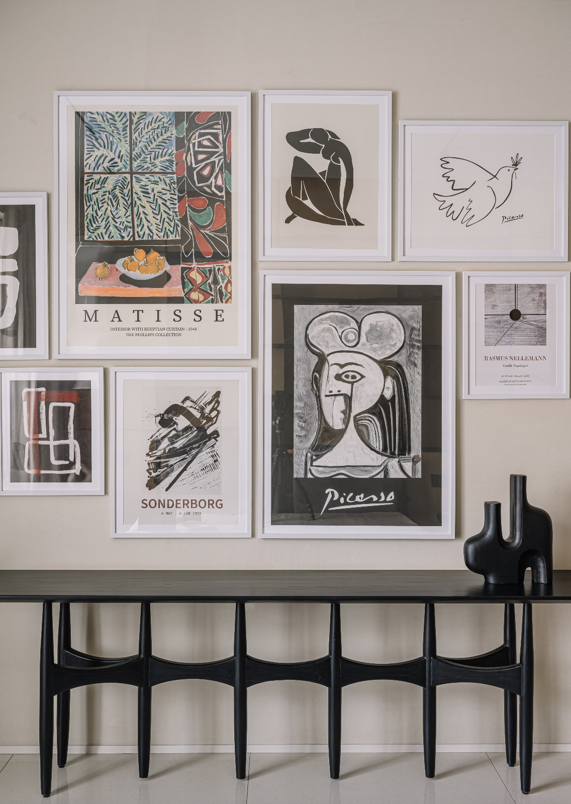 Playful artworks on display in a Japandi-inspired living room in an Ahmedabad, India, home designed by Workshop Inc.