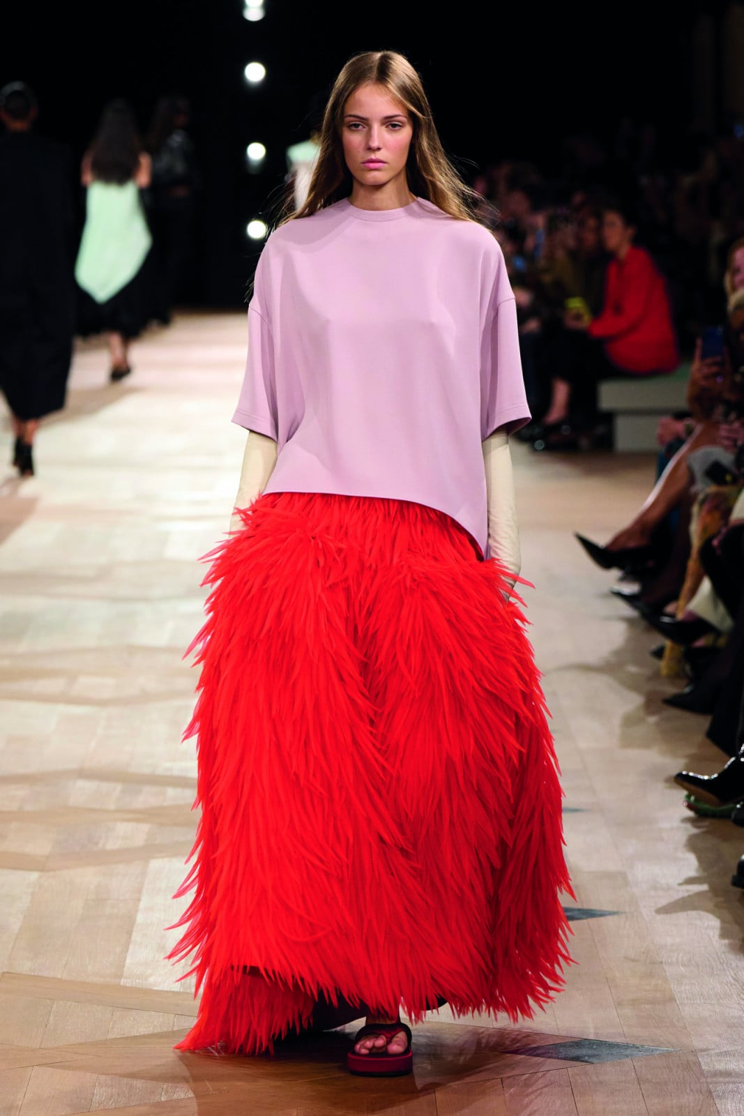 Red-orange feathered floor-length skirt by Balenciaga