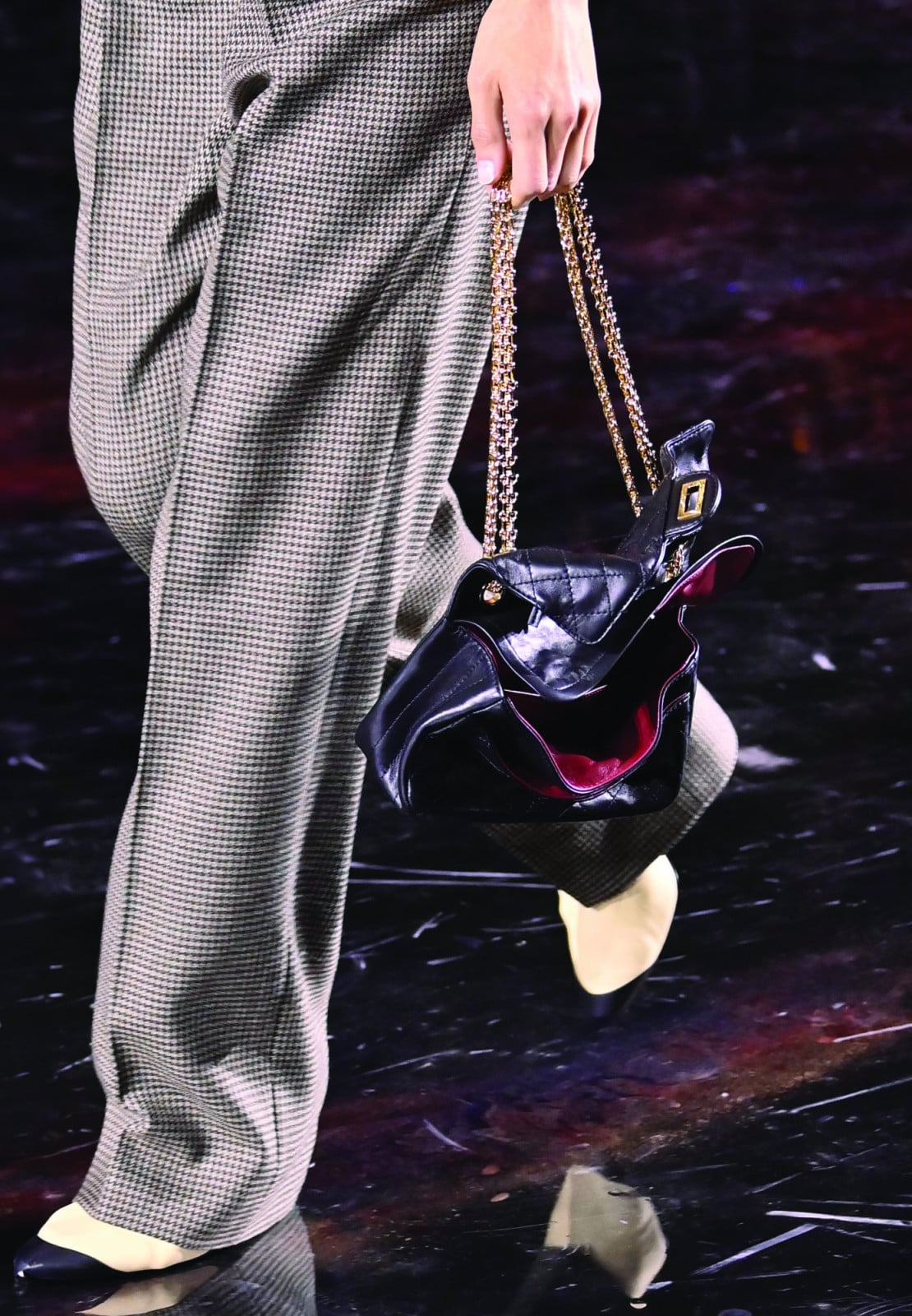 Black twisted flap bag by Chanel