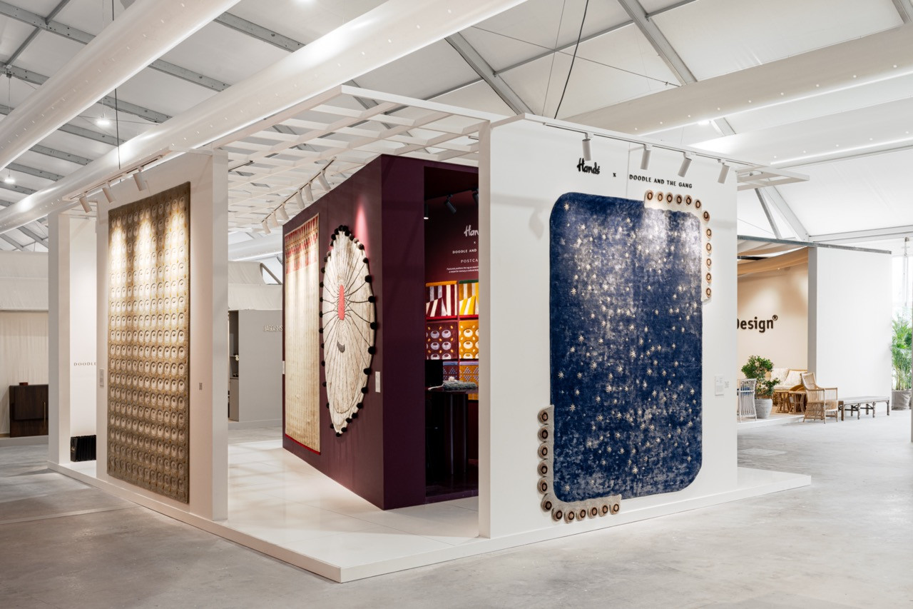 Rhe HANDS Carpets booth at Downtown Design displays the Postcards collection as wall hangings, including the cream-coloured Marigold sculptural piece