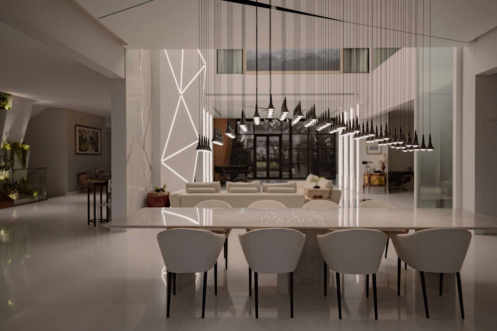 The multigenerational home’s multiple lighting installations reinforces lighting as a unifying architectural gesture across the open-plan living space