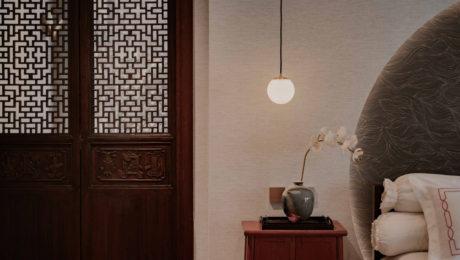 A close-up reveals the bedroom’s nuanced material palette