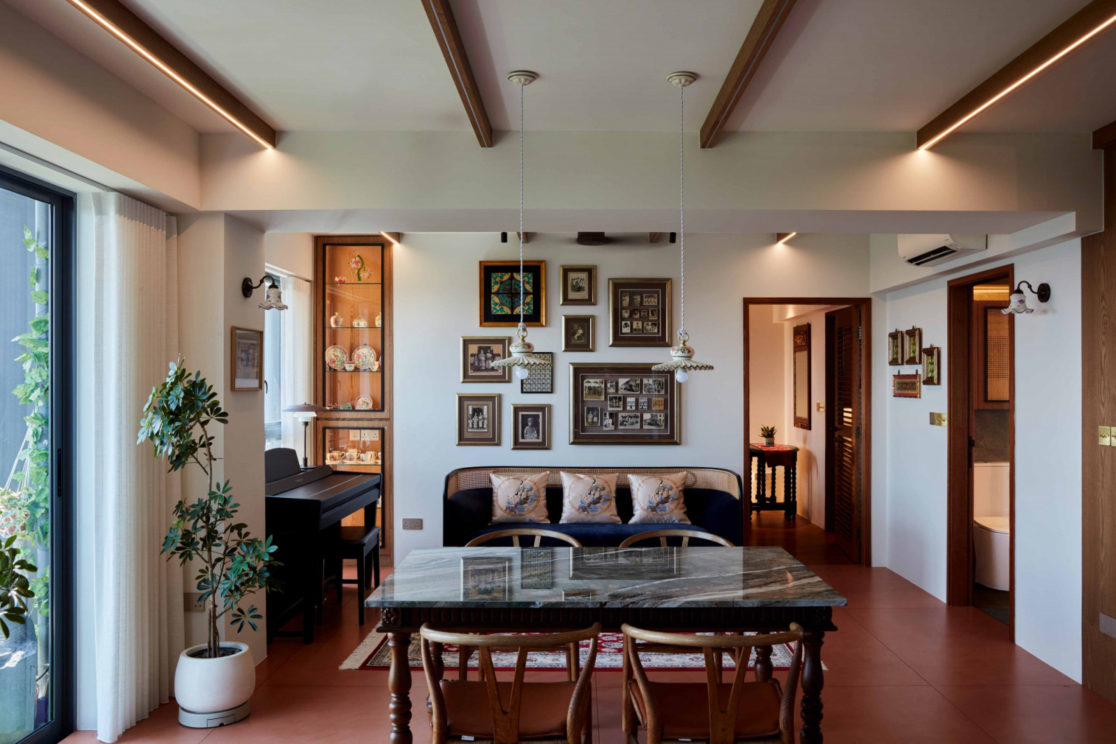Old-style timber ceiling beams incorporate LED strips for ambient illumination in the Peranakan apartment’s communal zones