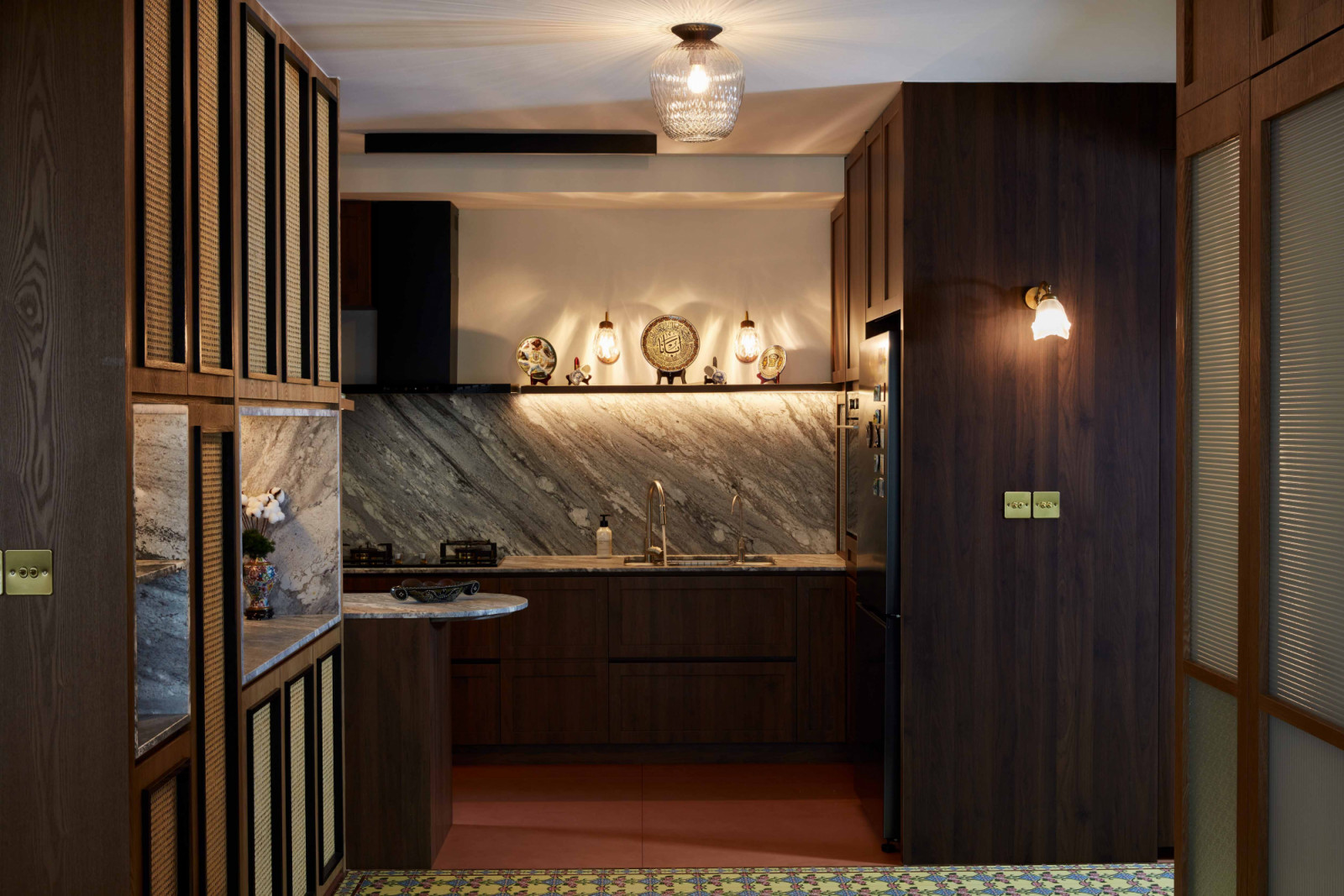 Peranakan collectibles lend a rustic charm to the sleek kitchen