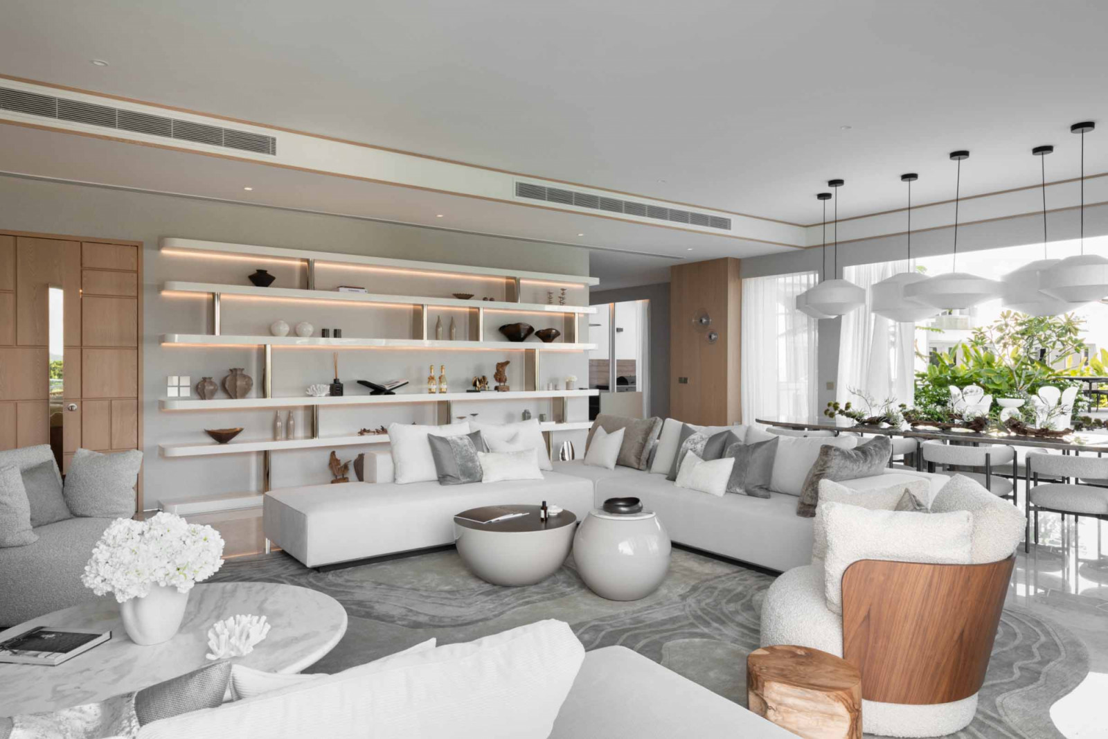Island living meets quiet luxusy at the Ho Bee Land super penthouse’s living area, which offers plenty of room for its inhabitants’ decor collection