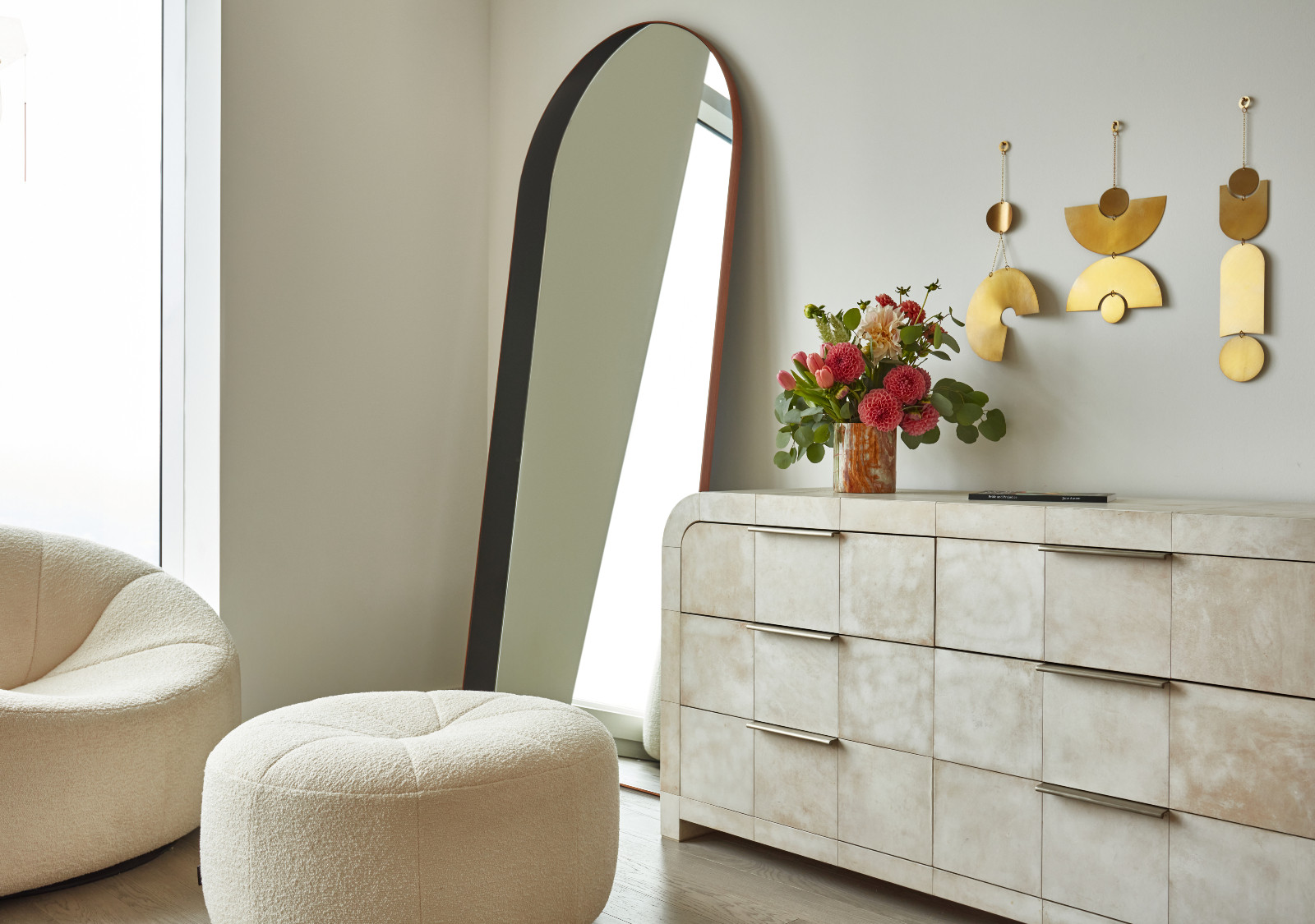 The bedroom of a young beauty entrepreneur's apartment in Los Angeles, designed by The Scale Collective