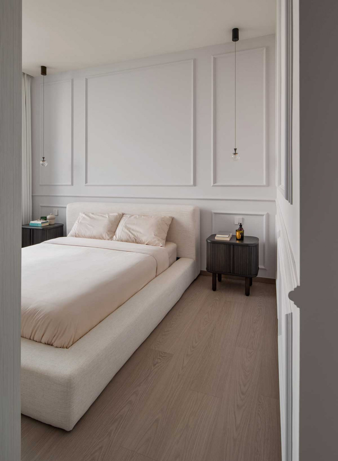 Wainscoting adds an elegant touch to this feature wall in the master bedroom