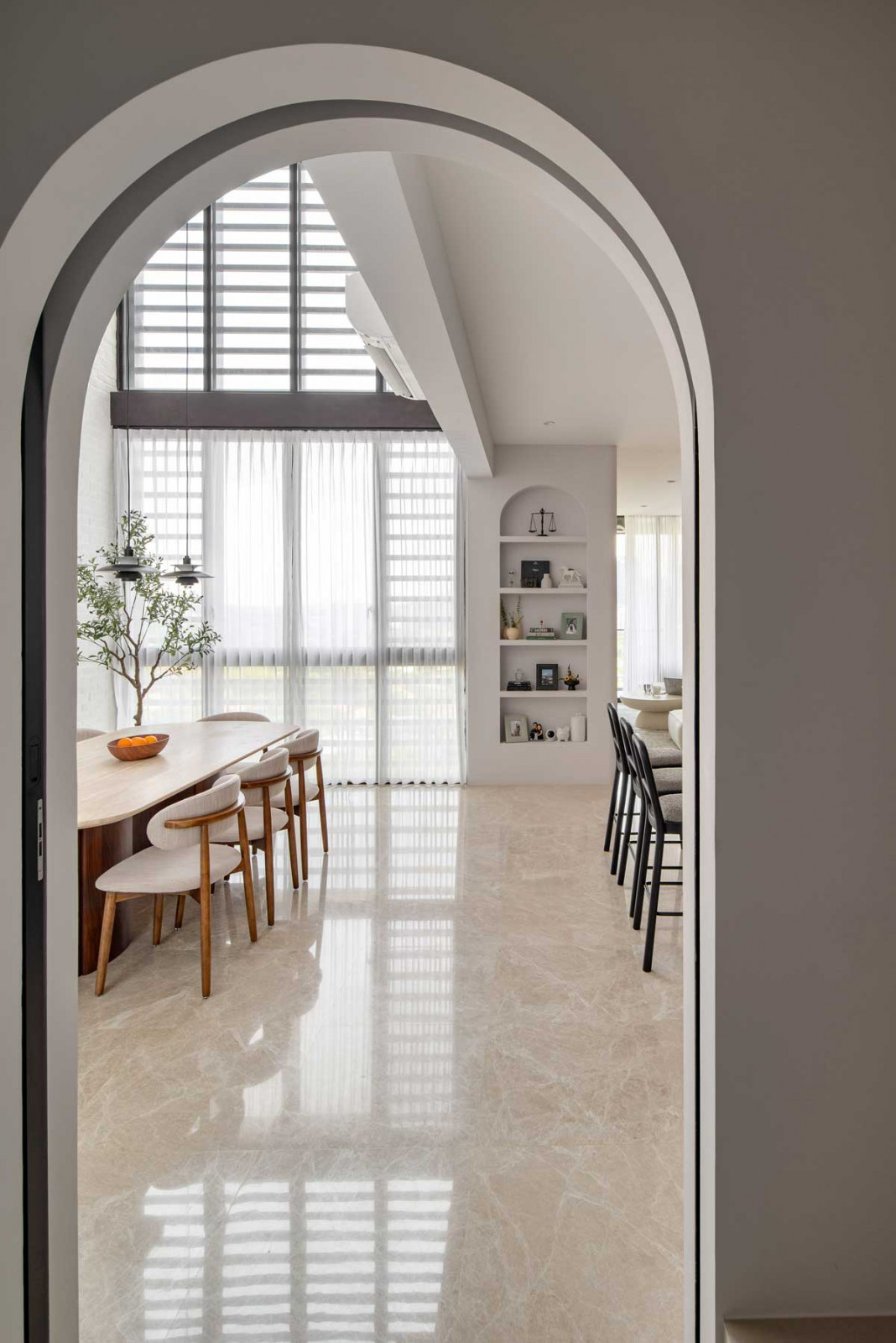 The double-volume dining area is the highlight of the apartment