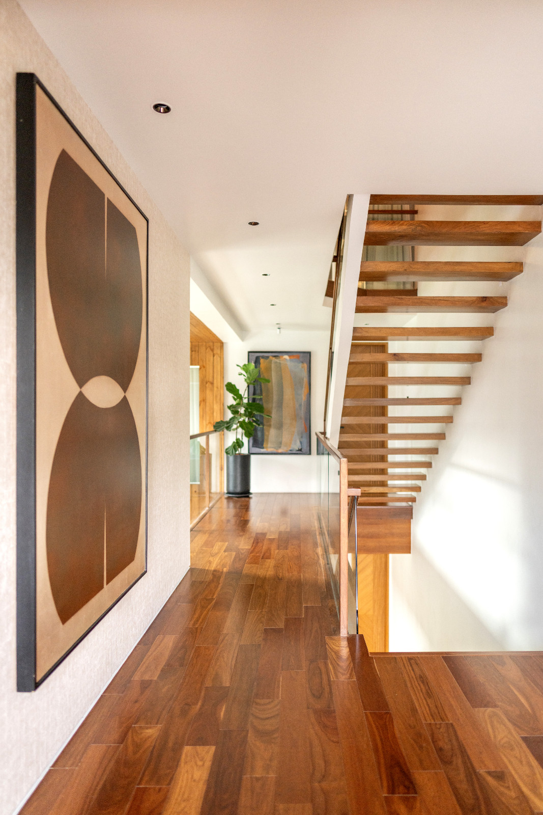 The corridor to Pia Wurtzbach Jauncey's bedroom is bright and linear, contrasted with local Philippine hardwood in a rust tone