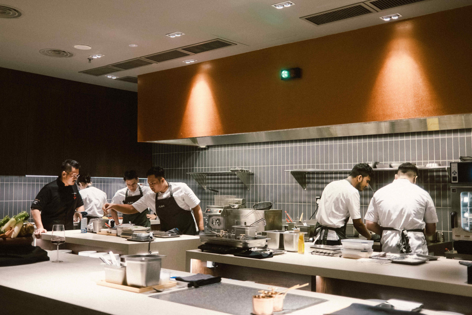 The workstations feature height-adjustable countertops with easy-to-maintain Dekton surfaces