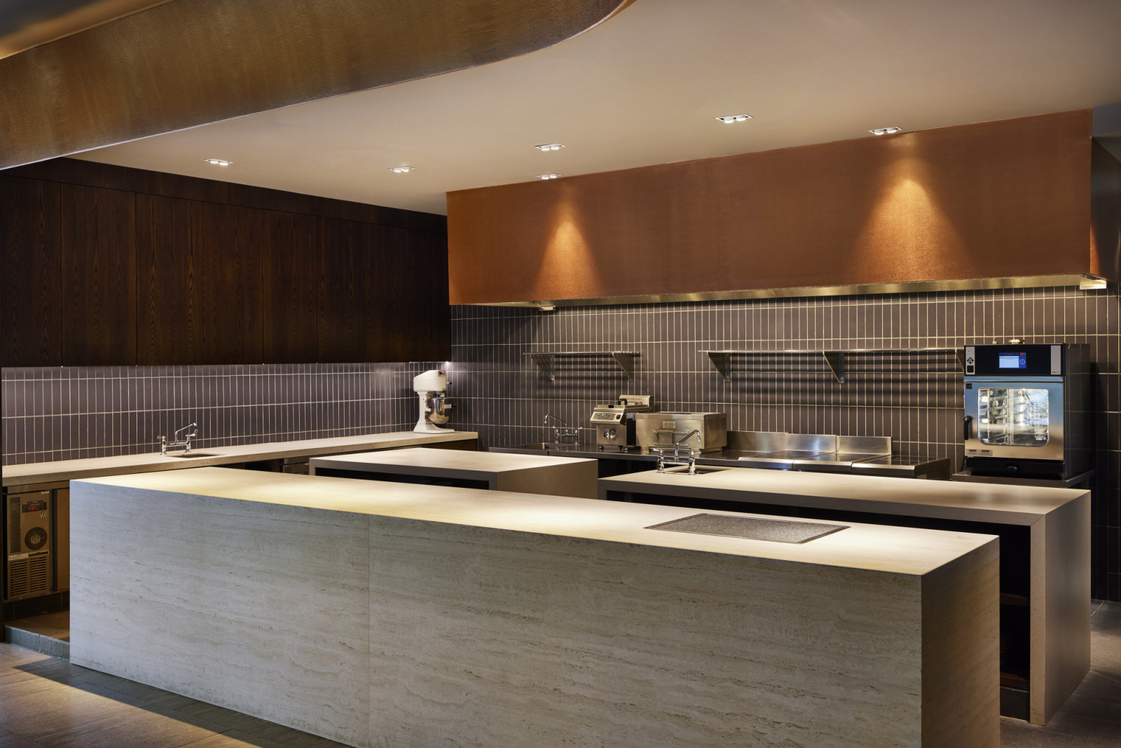 The ultra-minimalist open kitchen prioritises workflow efficiency and minimises unnecessary movements