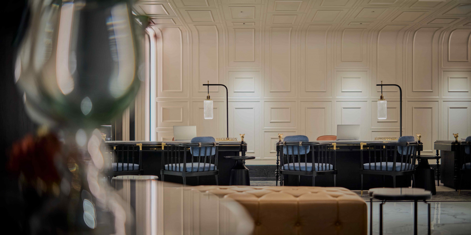 The polished Silestone Et Calacatta Gold greets guests at the reception desk (Photo: Bingkha Studio)