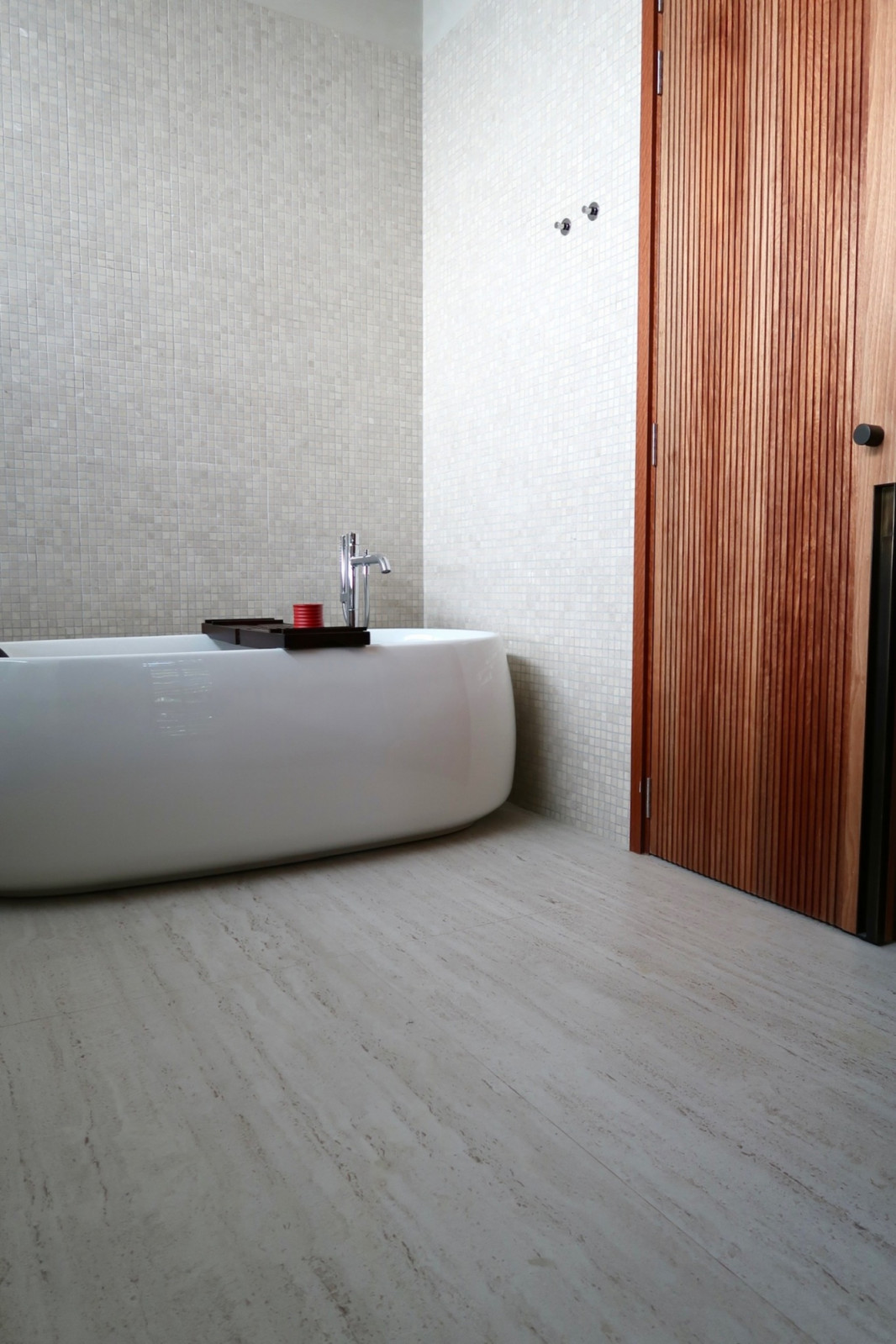 It creates a layered and rich material palette without overwhelming the balance of the space
