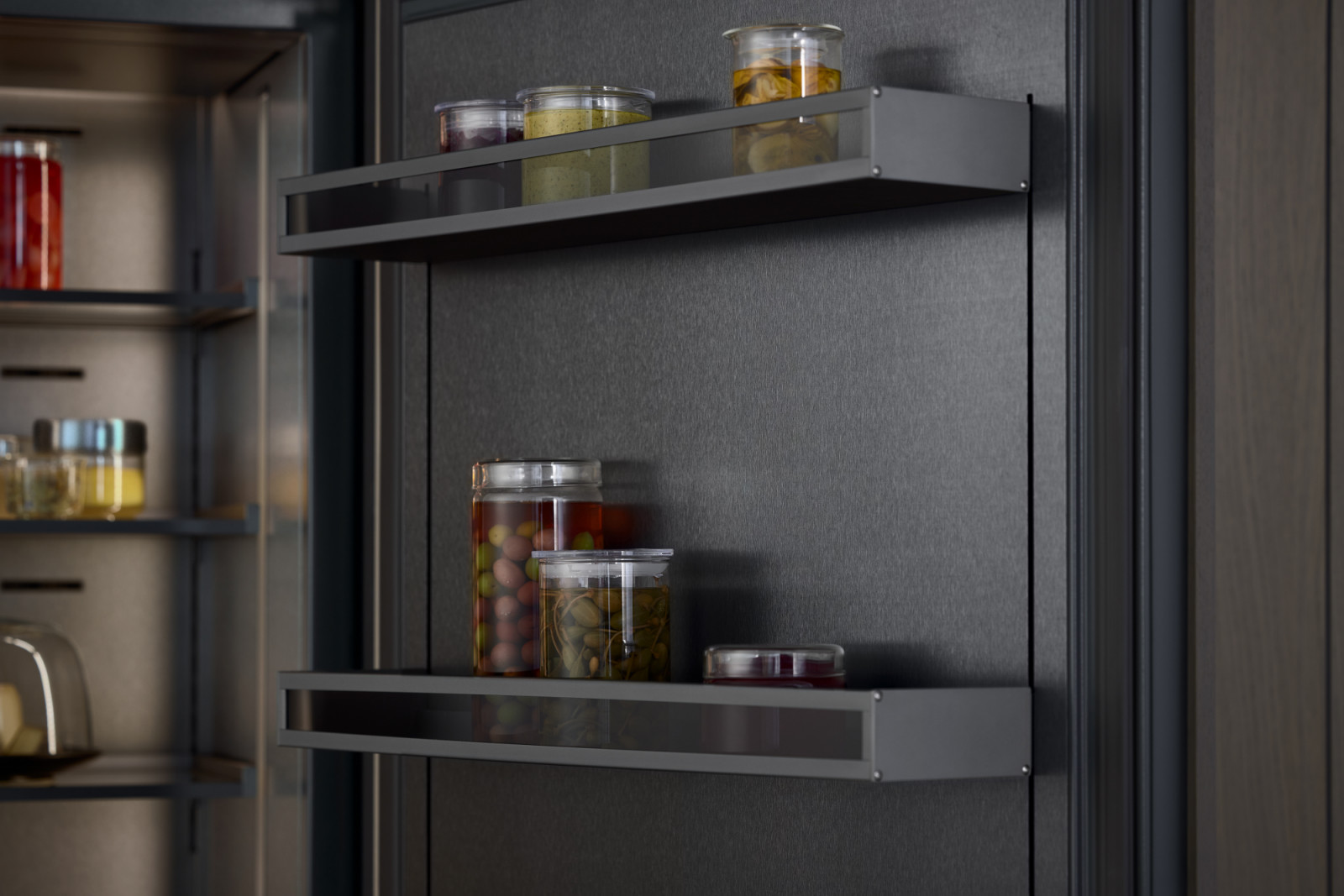 Internally, the material palette is consistent and restrained. Dark brushed stainless steel, anthracite aluminium and glass create a calm, coherent interior (Photo: courtesy of Gaggenau)