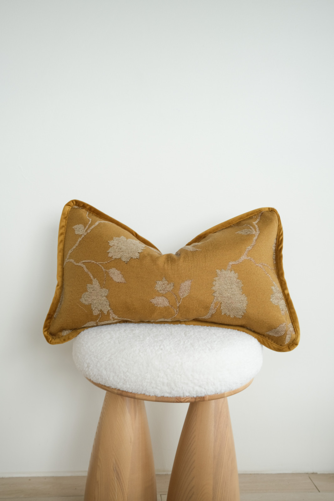 Twenty Third lumbar pillow in golden tone with floral tapestry pattern and contrast piping trim