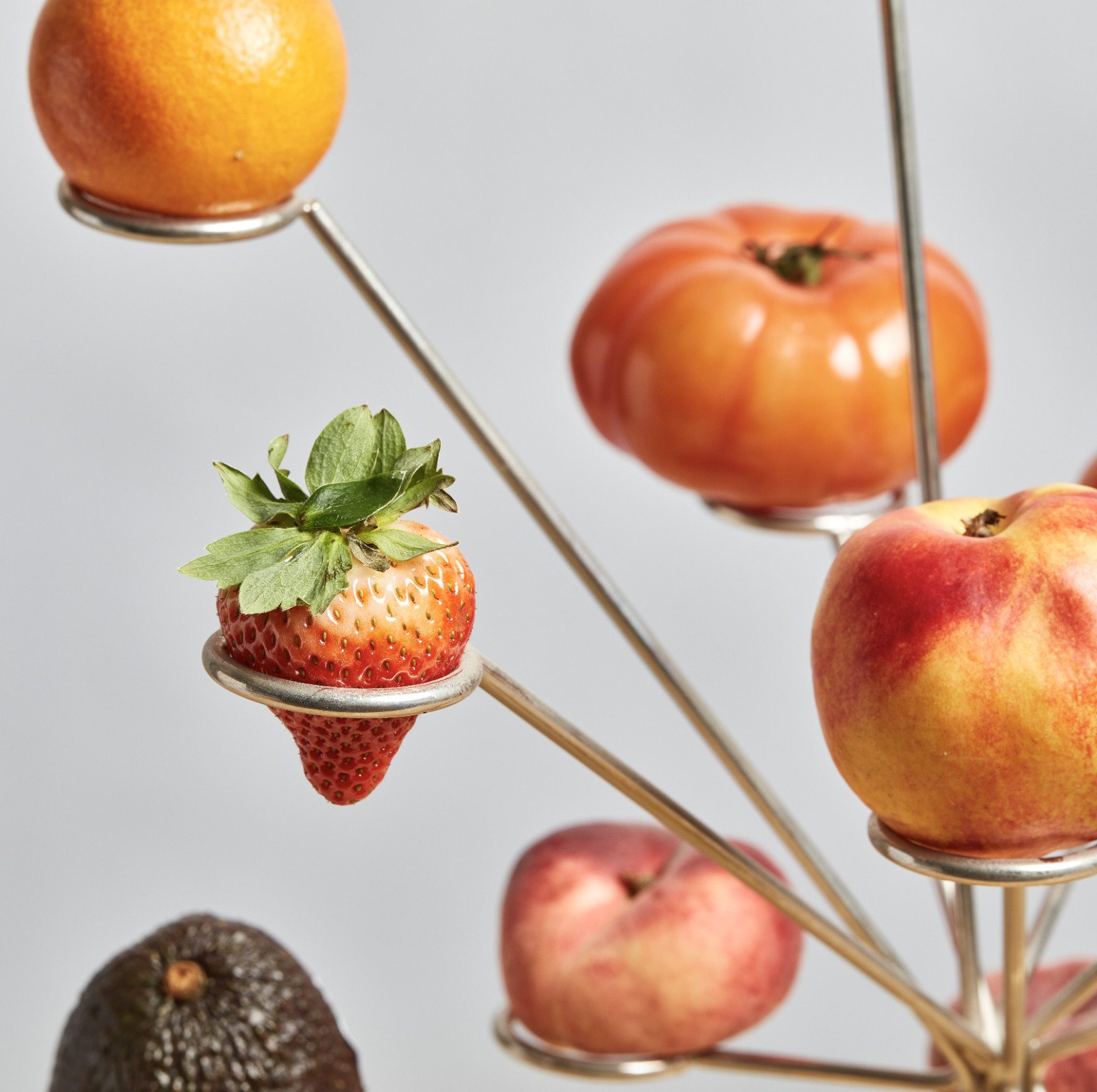 Detail of the Exploded Fruit Bowl showing individual fruit placement on separate platforms