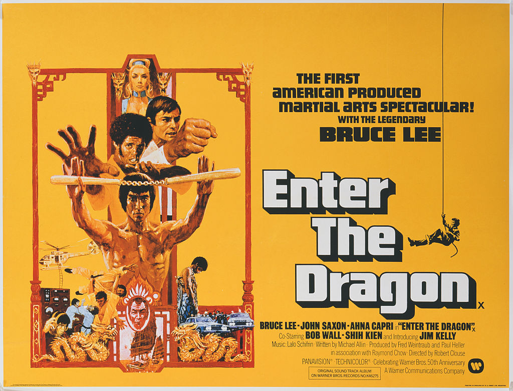 A poster for the British release of Robert Clouse's 1973 martial arts action film, 'Enter The Dragon', starring (bottom to top) Bruce Lee, Jim Kelly, John Saxon and Ahna Capri. (Photo by Movie Poster Image Art/Getty Images)