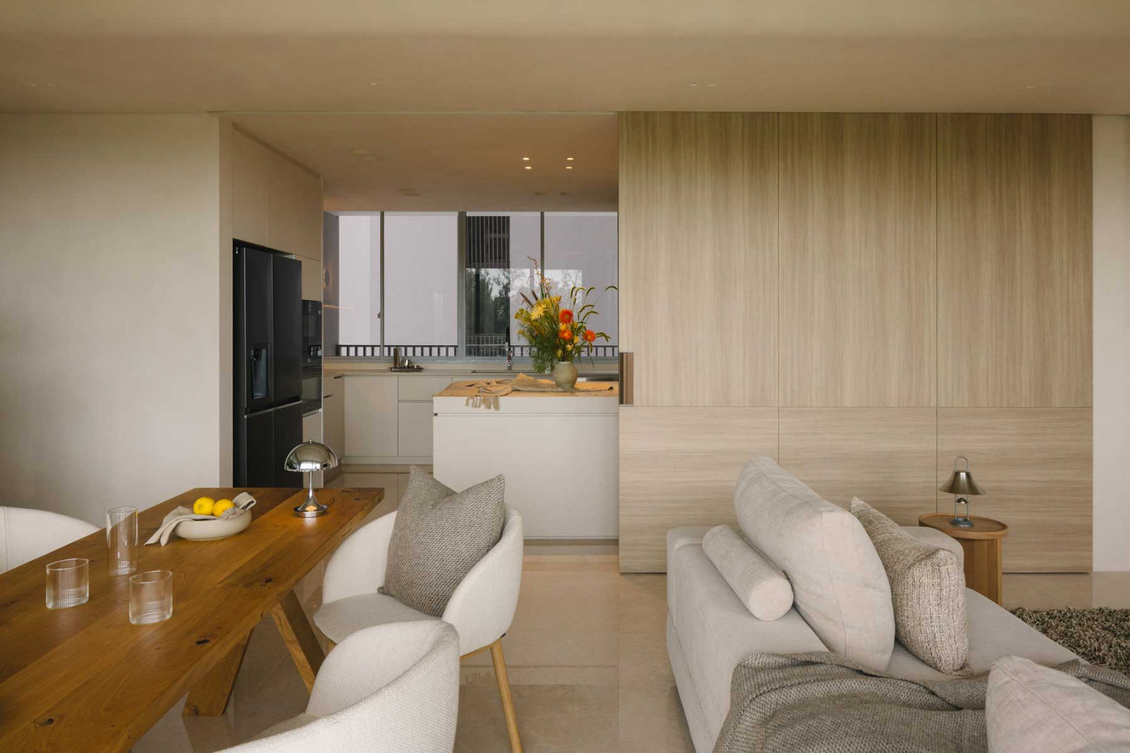Tone-on-tone finishes ground the various spaces and pulls the entire look of the East Coast apartment together