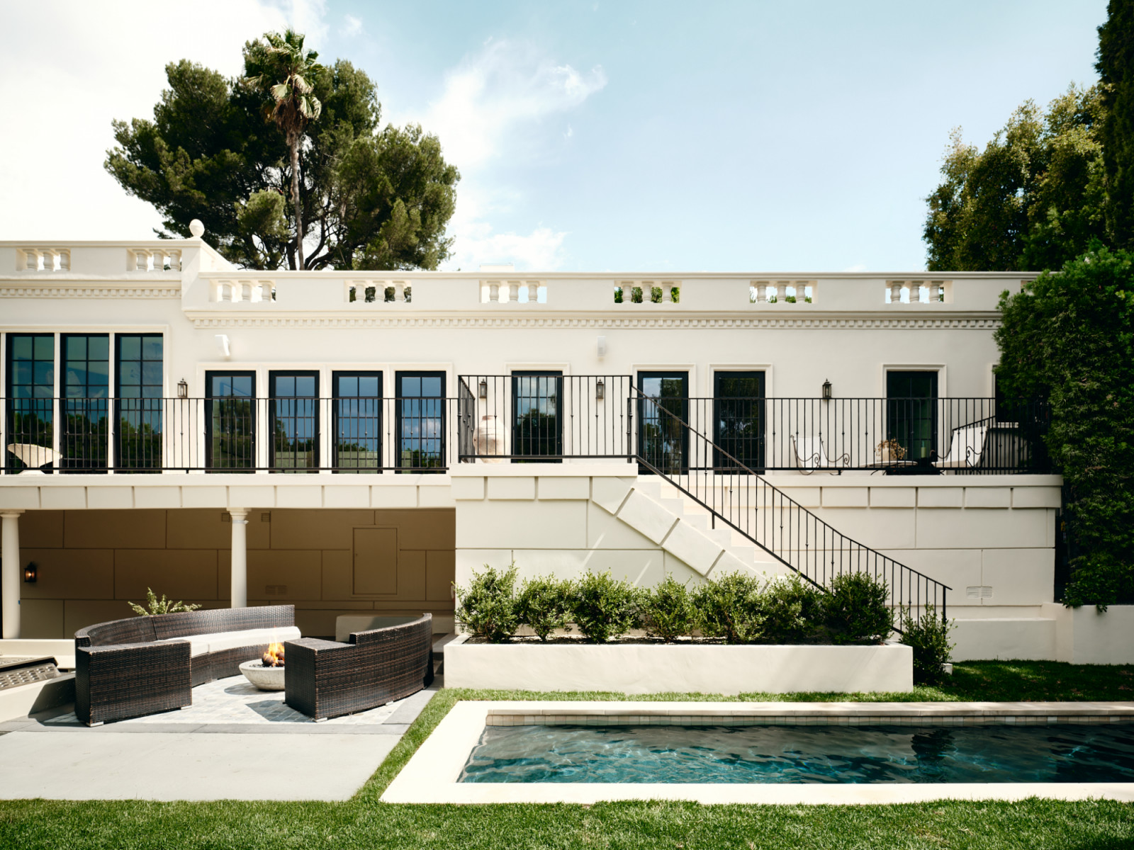 The pool and garden area of a Los Angeles, California home renovated by House of Rolison