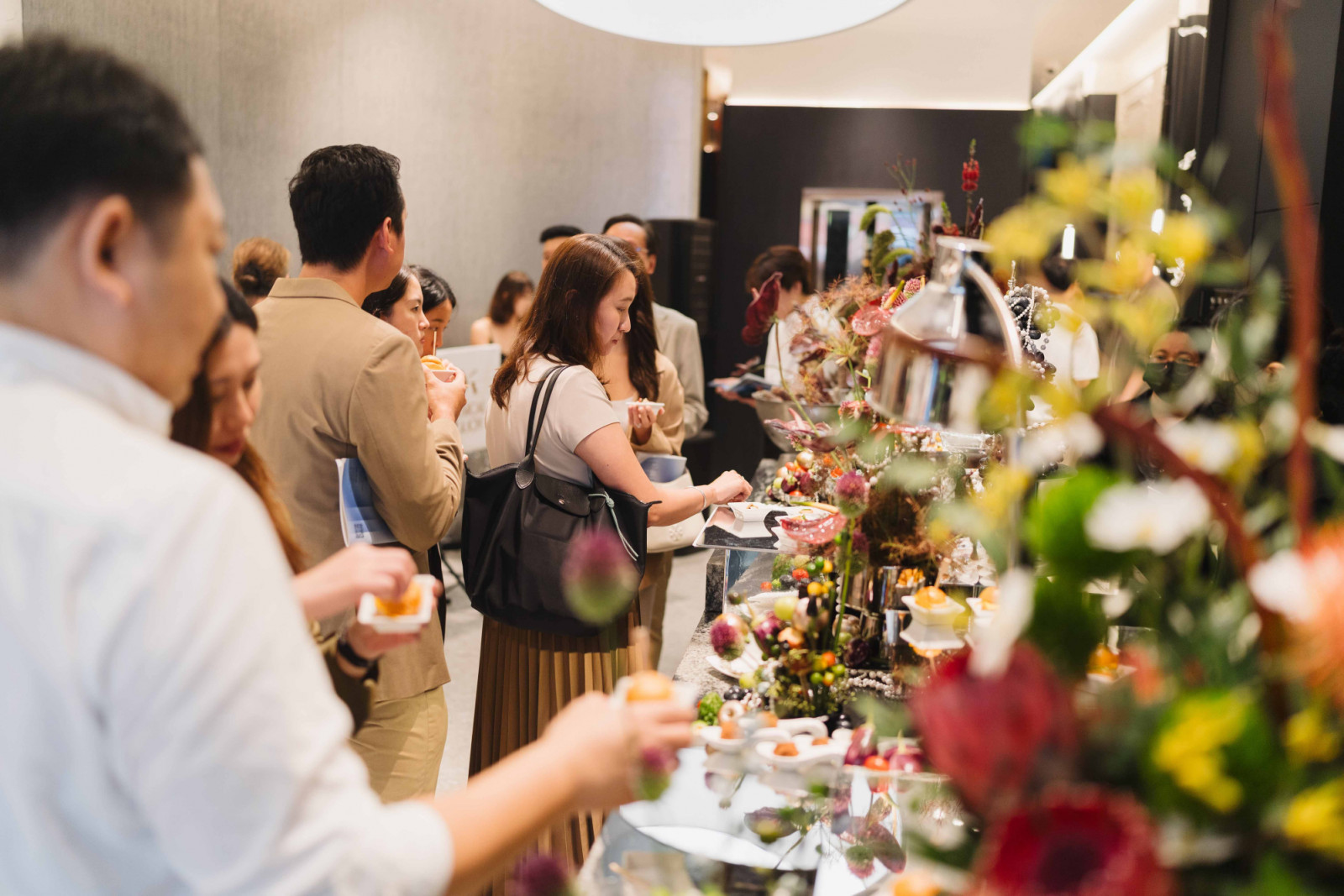 Guests indulged in the beautifully curated food presentation set on ABCD's natural granite island on level one of the studio
