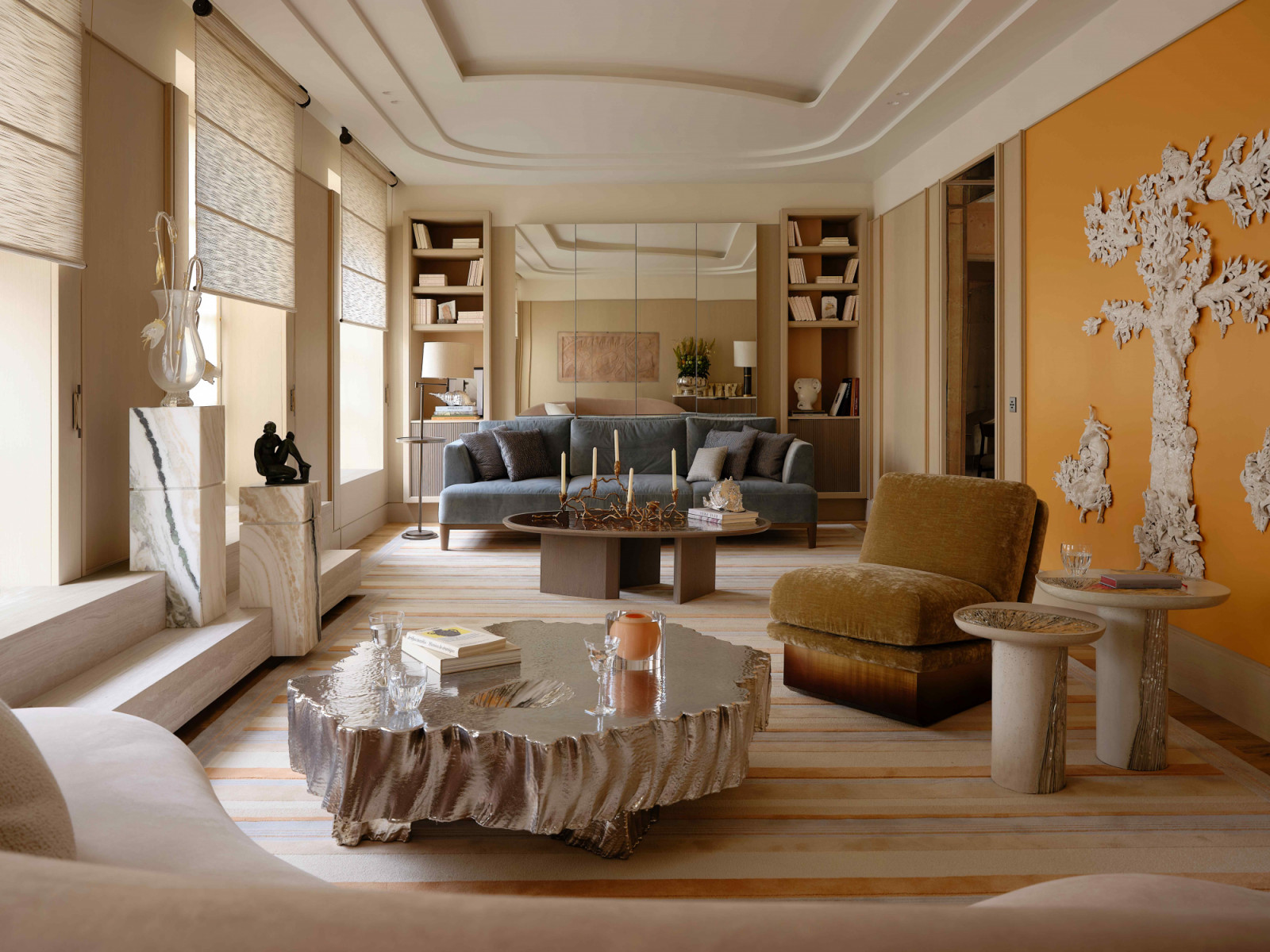 The Haussmannian apartment unfolds in a jewel box-like sequence of reconfigured volumes, evoking the ambiance of a refined hotel suite