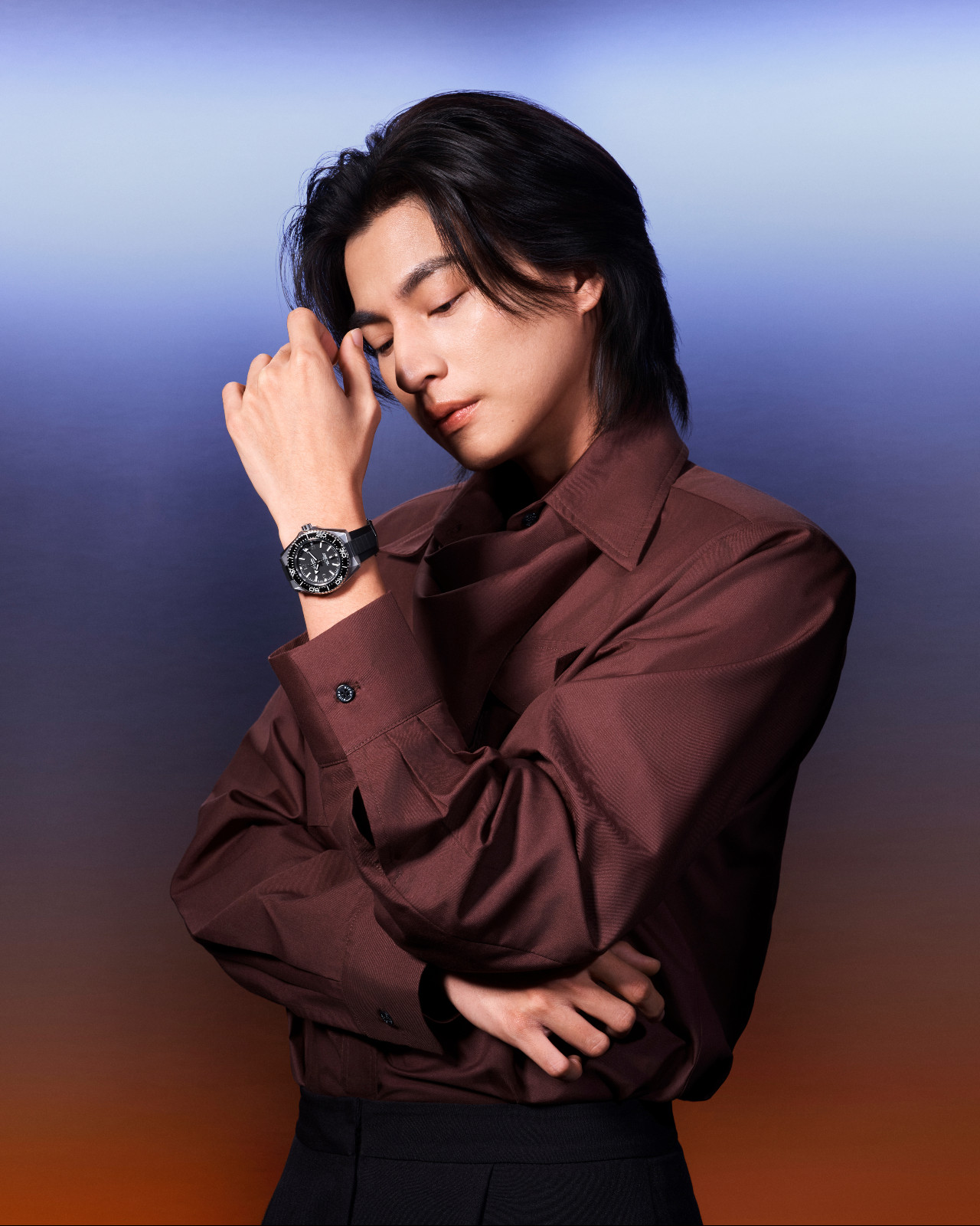 Gulf Kanawut wearing the Omega Planet Ocean in black