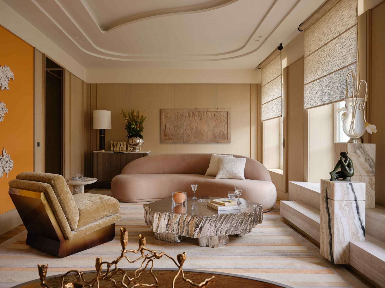 The pearly peach patina recalls the fiery sunsets in Paris, with brass and burnt browns reminiscent of the golden hour