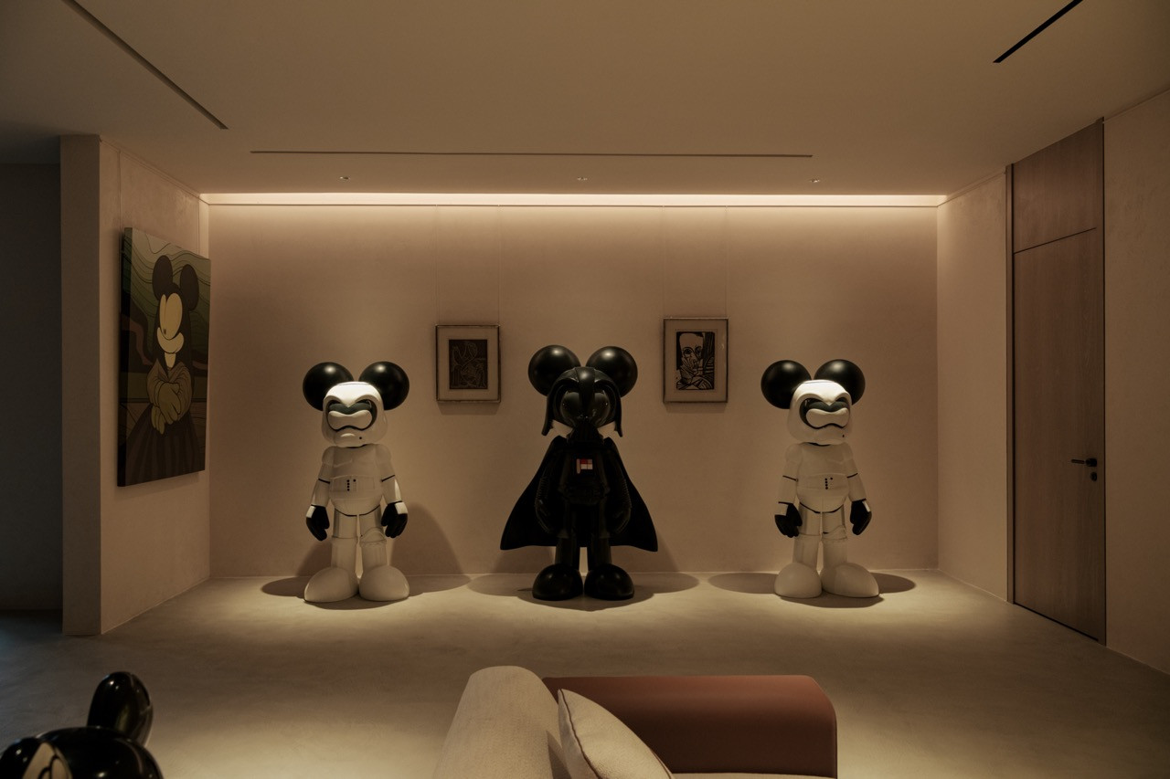 Display of Mickivader sculptures from 2023, gifted to the owner by a late friend, flanked by Picasso auction pieces