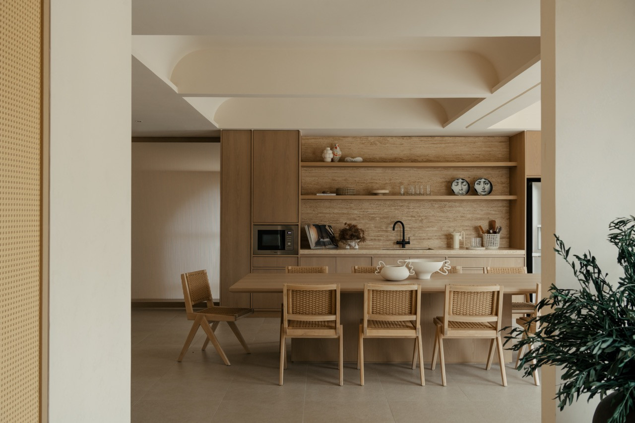 View through arched opening to the kitchen, demonstrating the curved architectural elements that required careful negotiation of the existing structure