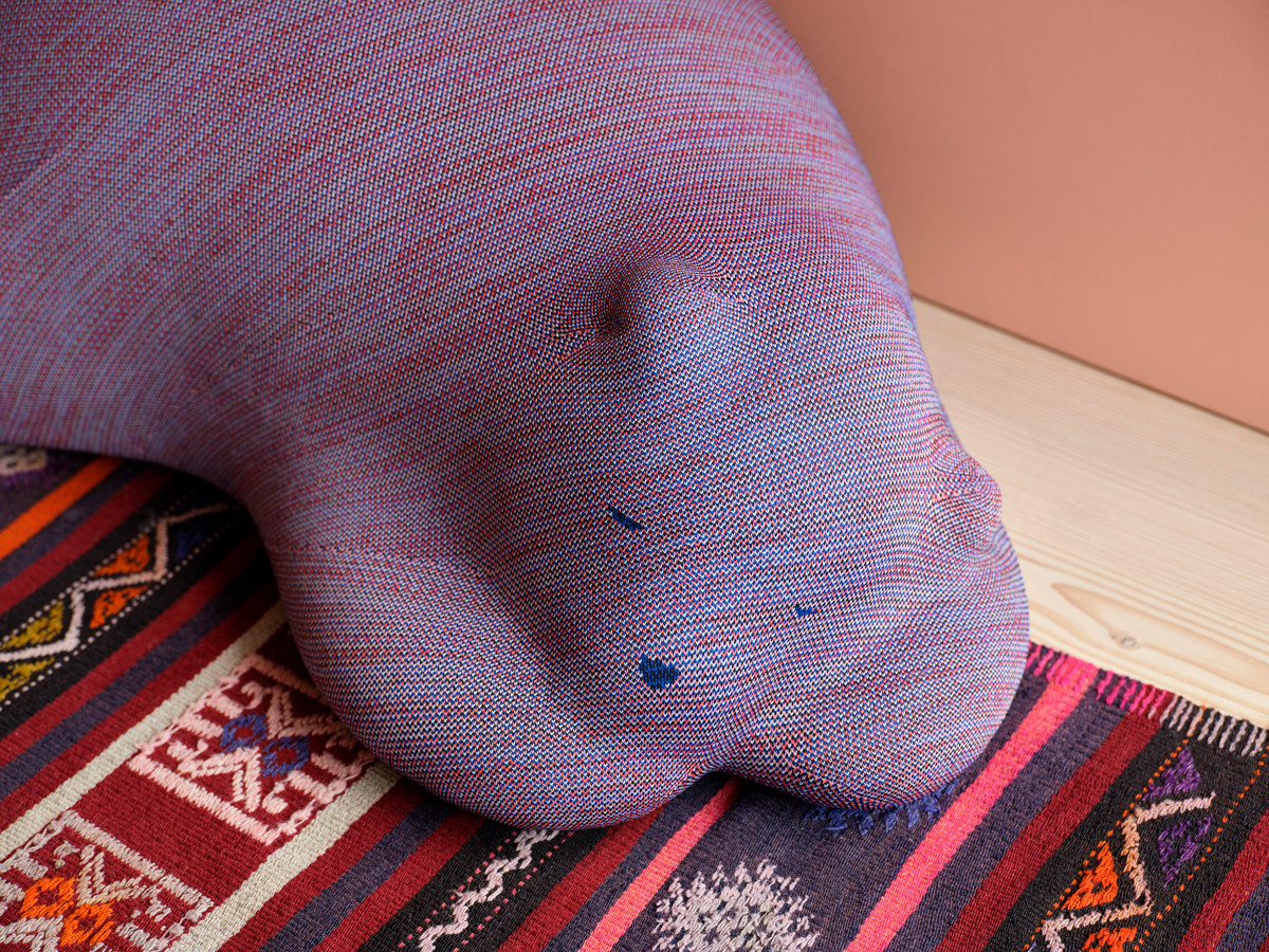 A close-up of Vitra’s Resting Bear highlights the multicoloured yarn of its upholstery, revealing the richness of its tactile detail