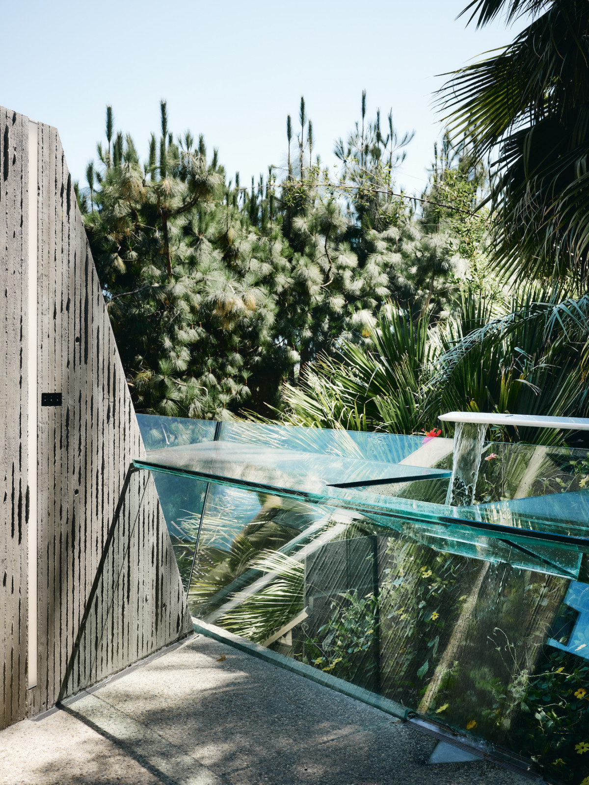 An unexpected confluence of concrete and glass at the Sheats-Goldstein Residence, renovated by Conner + Perry Architects in Los Angeles, California