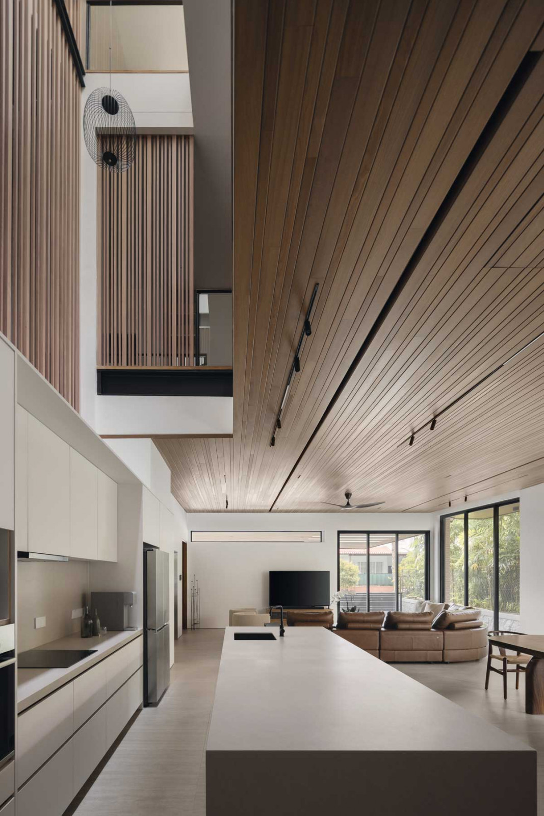 The immaculate dry kitchen, which features an elongated island for large gatherings