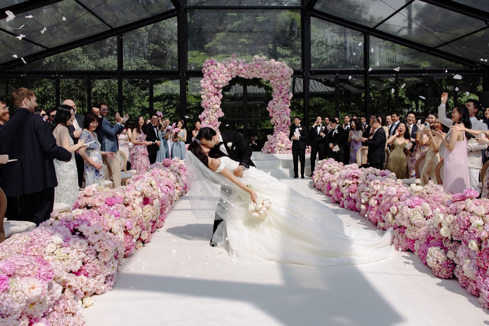 Yeoh and Low sharing their first kiss as husband and wife at their wedding (Photo: Sarah Falugo)