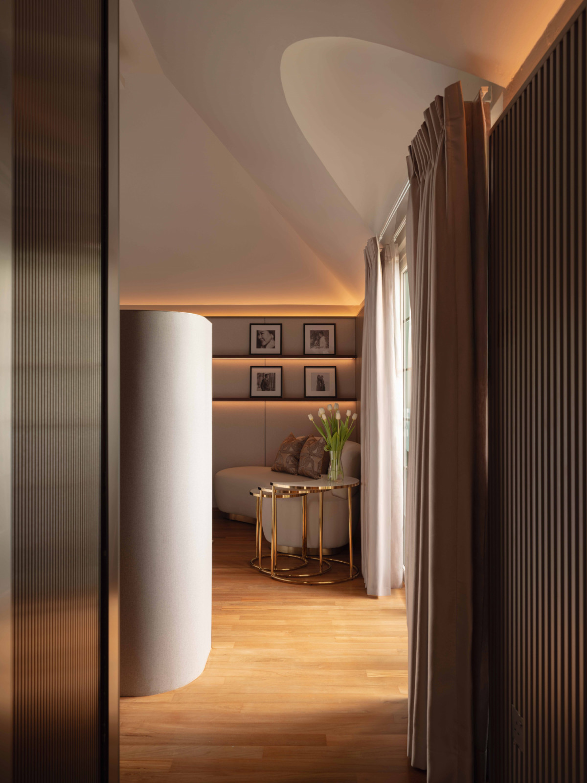 The Bukit Timah bungalow’s reimagined attic level is now a commodious master suite that incorporates a series of well-appointed spaces, including this snug, relaxing lounge