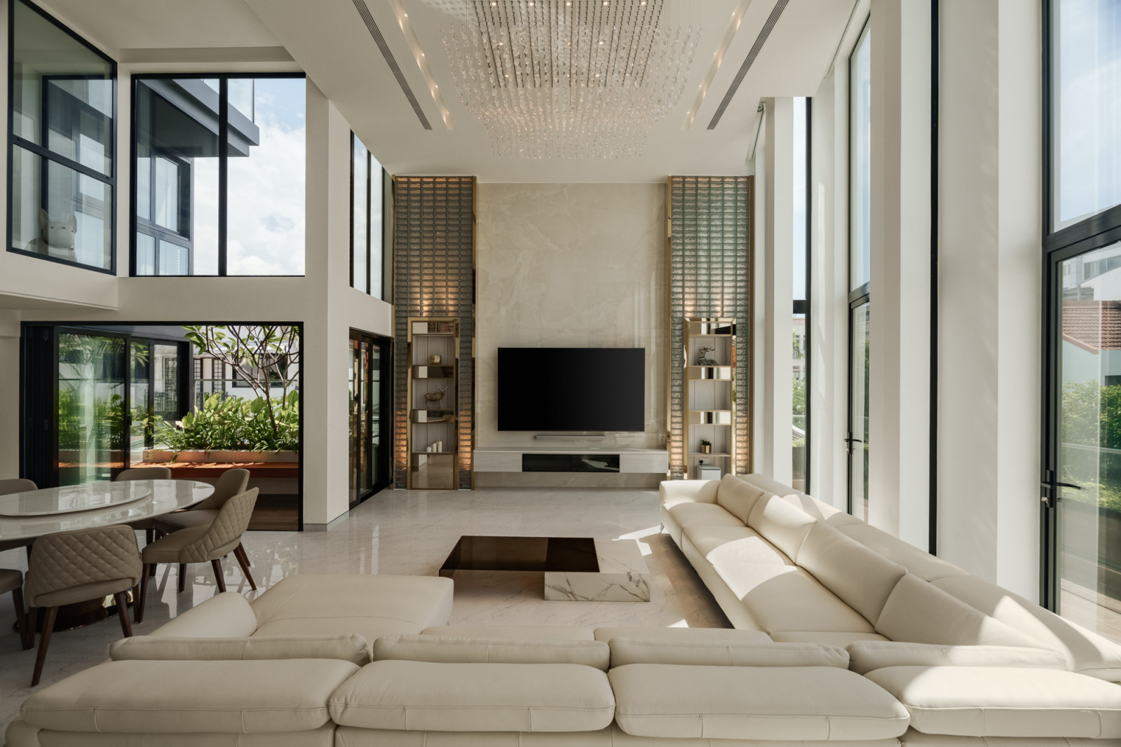 A view of the corner terrace house’s commodious living and dining zones, which are located on the second level and ensconced within a double-height volume