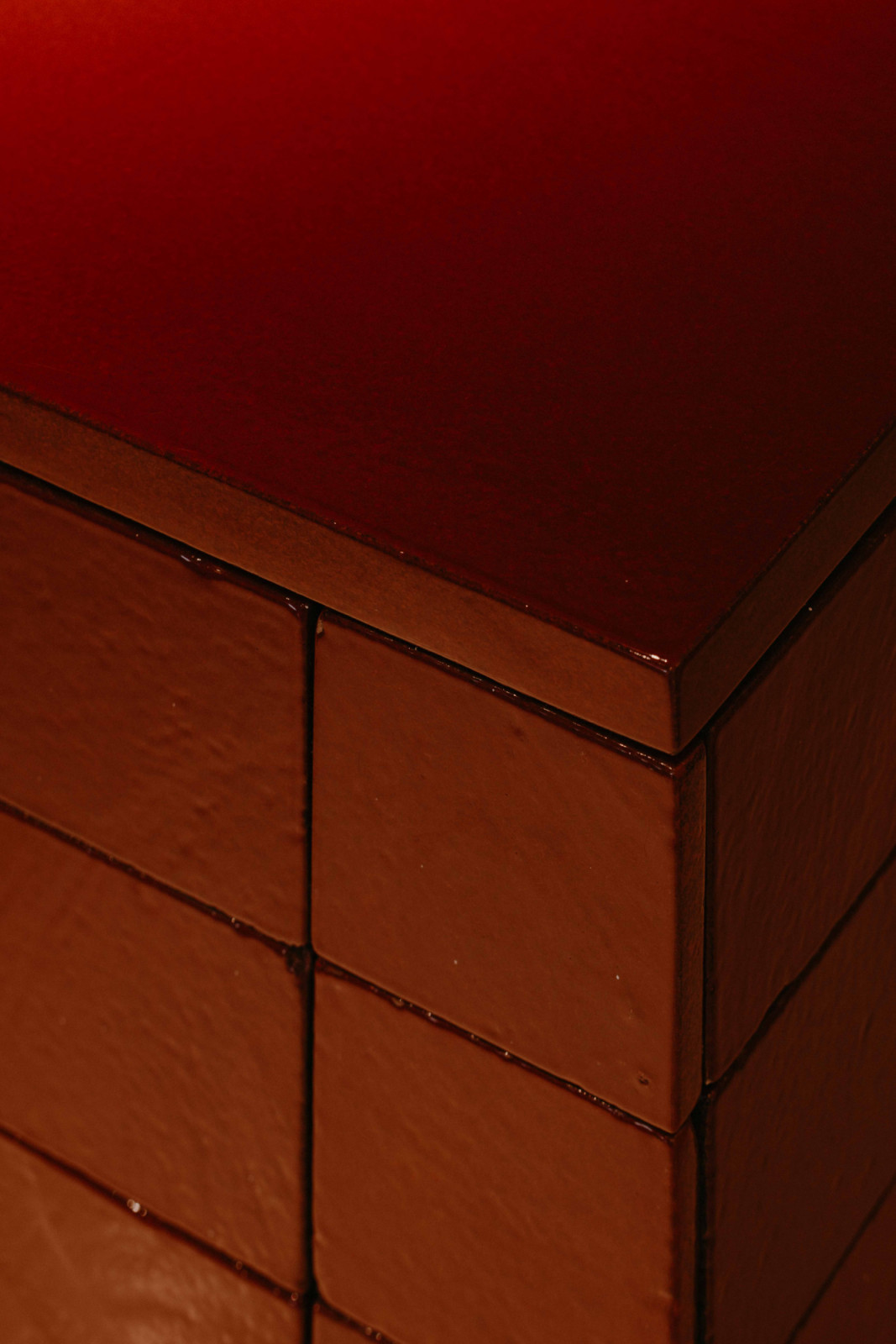 A close-up view of the terracotta kitchen counter, highlighting its subtle texture and warmth