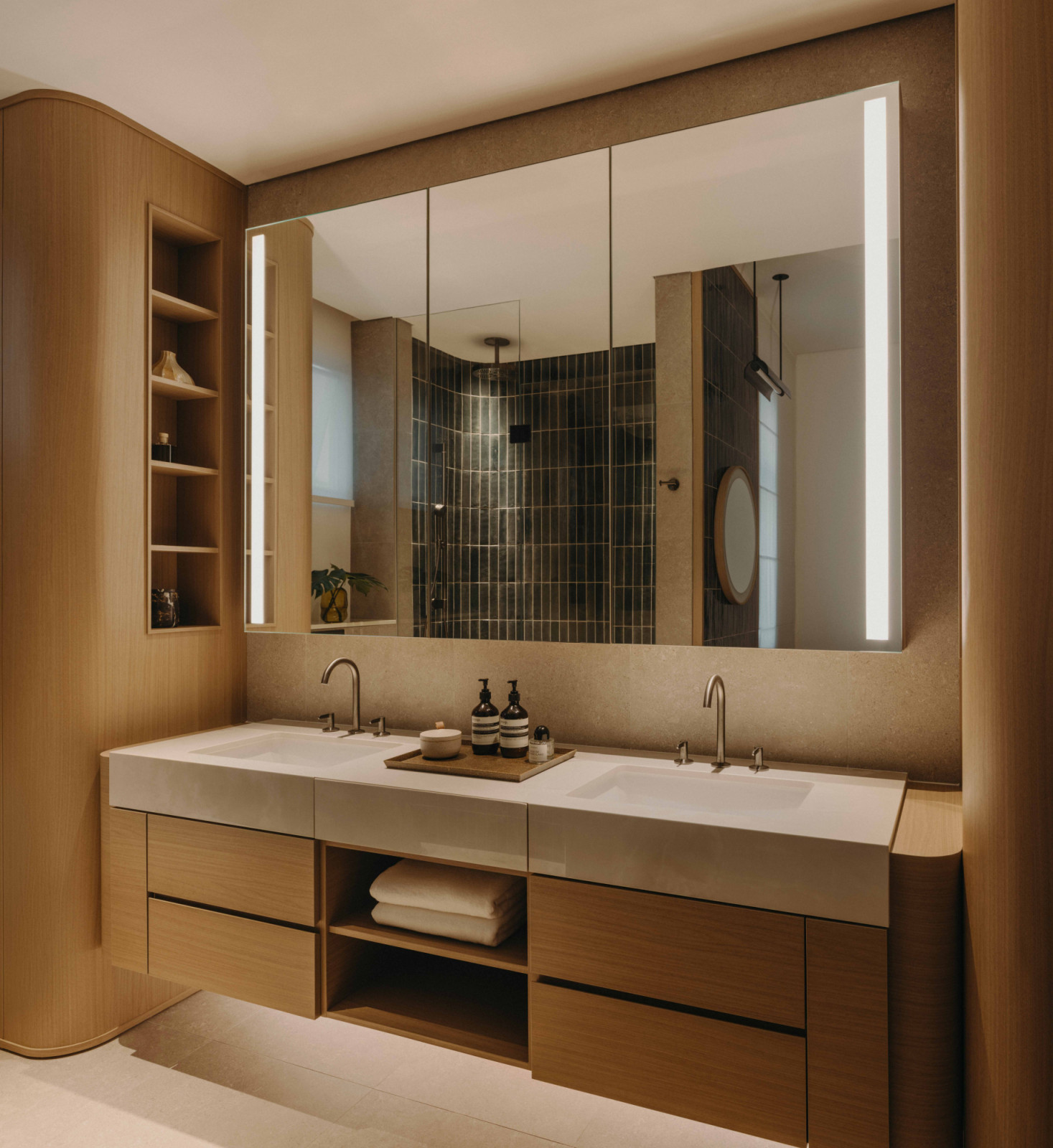 The master bathroom is fitted with his-and-hers sinks