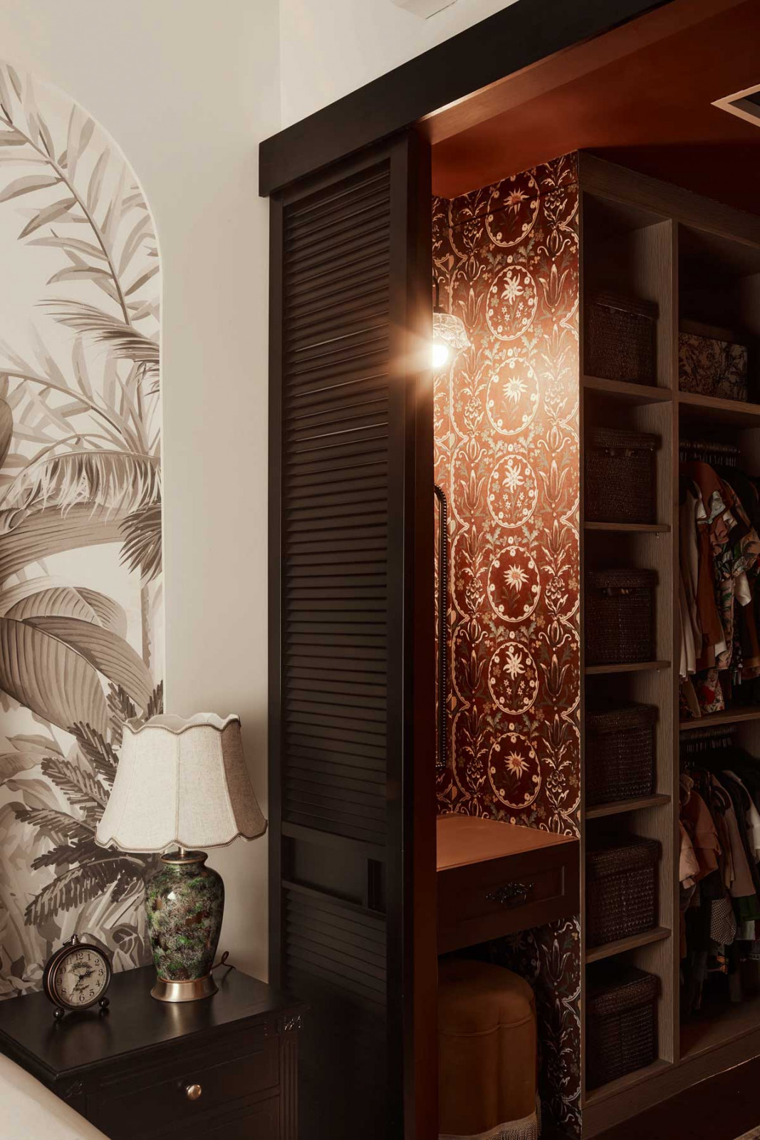 An intricate paper lining graces the inside of this wardrobe