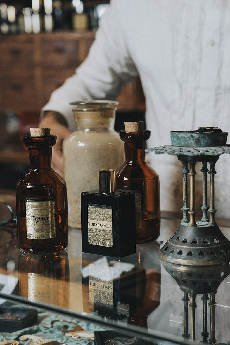 The amber vials and antique flacons within Sifr Aromatics