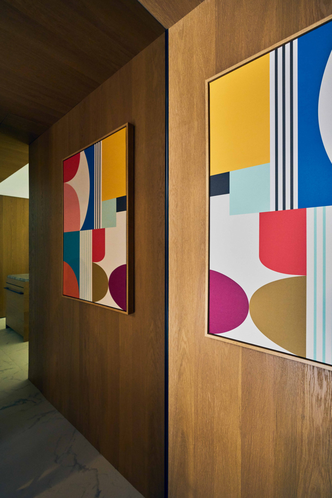 Vibrant abstract artworks add a dash of intrigue and colour throughout the abode
