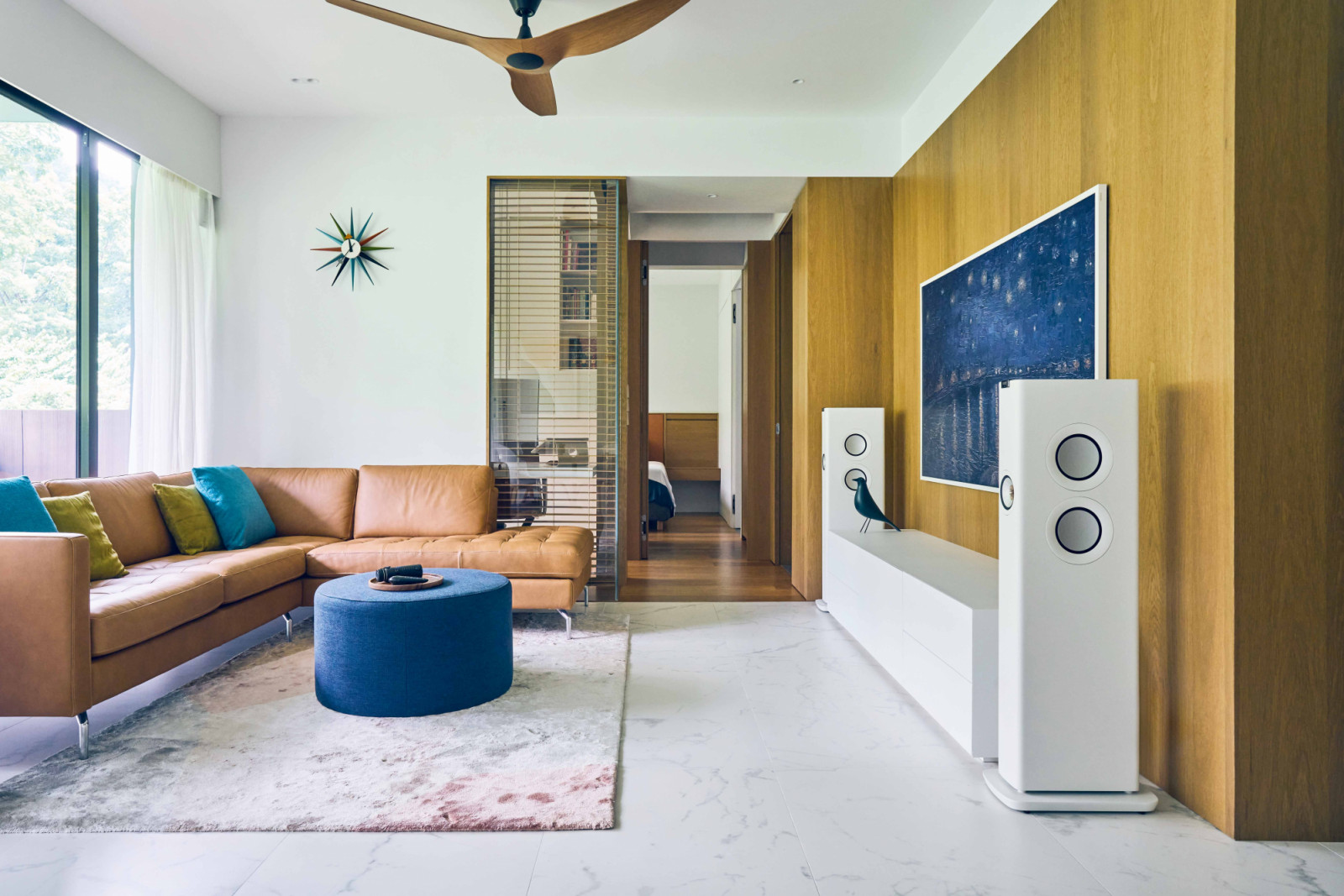 Rich blues and more sedate earthy tones generate a striking yet balanced aesthetic against the neutral backdrop
