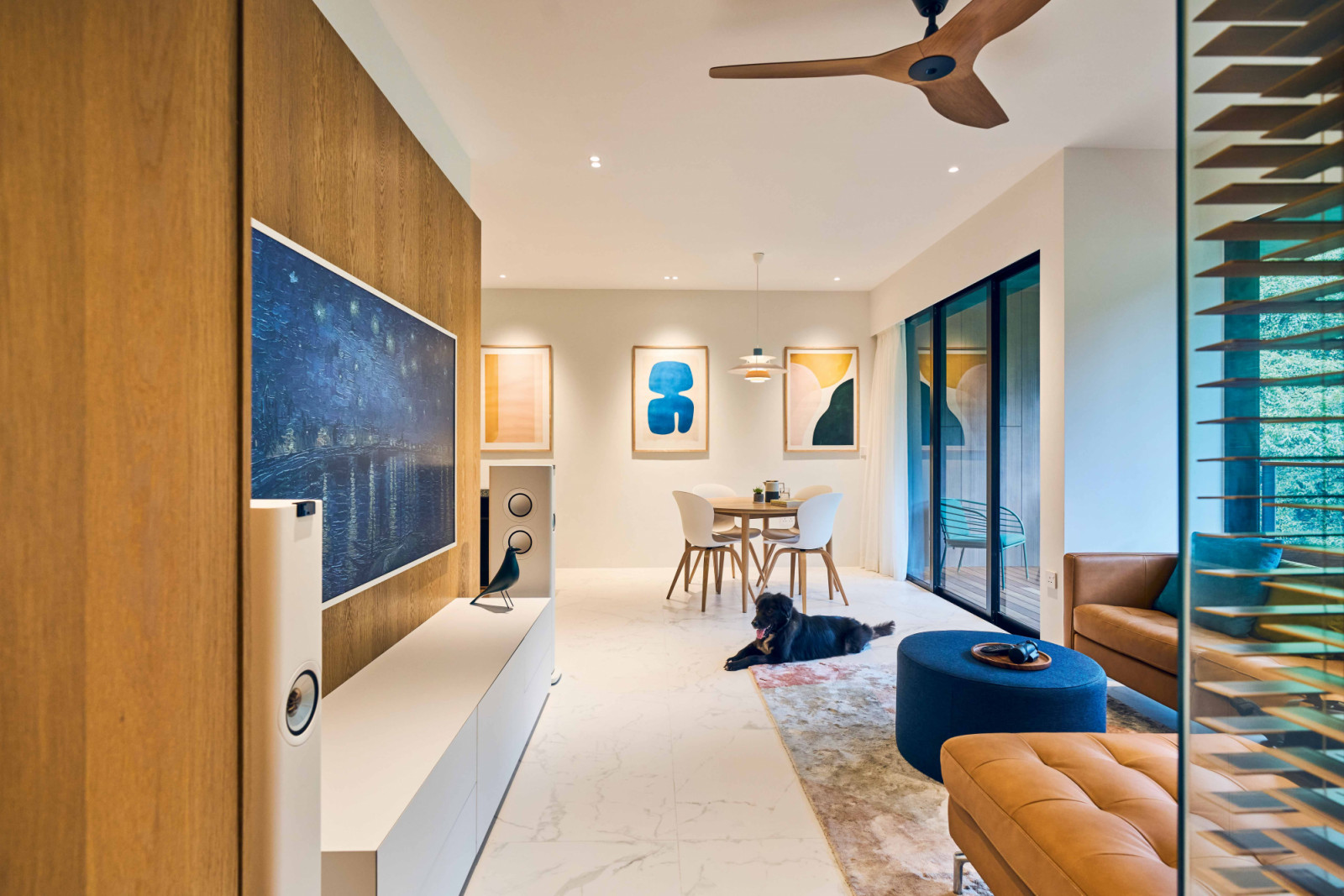 The owners’ pet dog cuts a contented figure in the home’s beautifully colour-coordinated common zone
