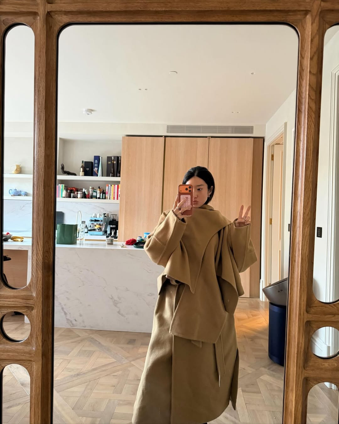 Structured outerwear that defines the outfit while remaining practical for travel (Photo: Peggy Gou/Instagram)